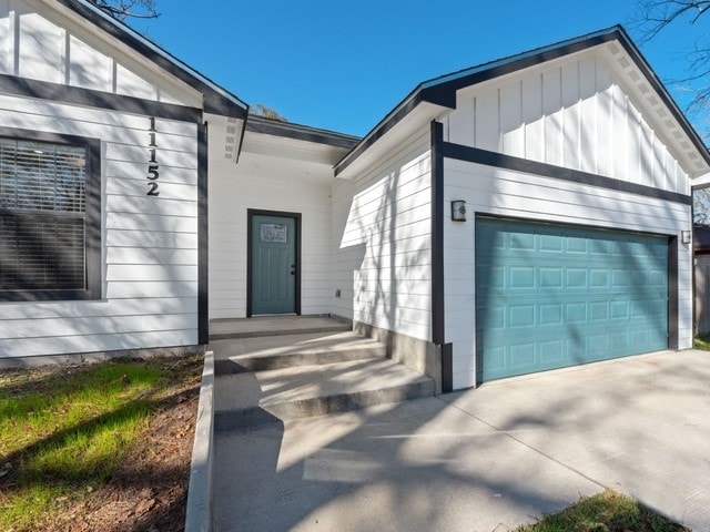 entrance to property featuring a garage