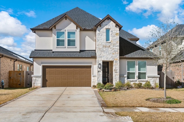8422 Harrington Grove Trl, Richmond, TX 77407 - view of front of home featuring concrete driveway, an attached garage, stone siding, and stucco siding