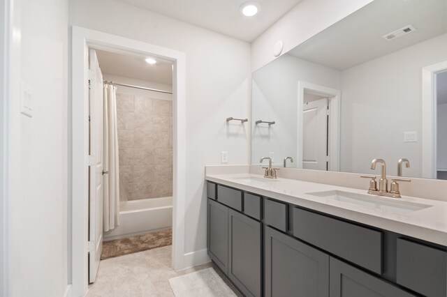 bathroom with vanity and shower / tub combo