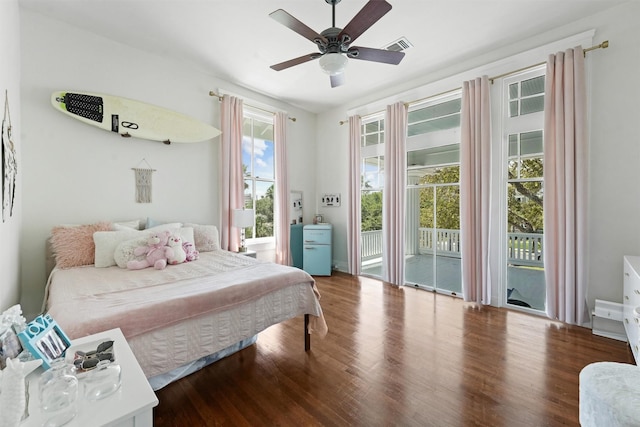 bedroom featuring hardwood / wood-style flooring, ceiling fan, and access to exterior