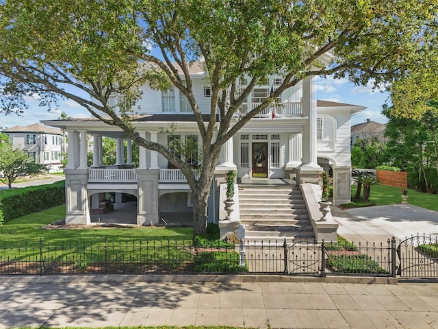 view of front of house with a balcony and a porch