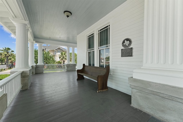 wooden terrace with a porch