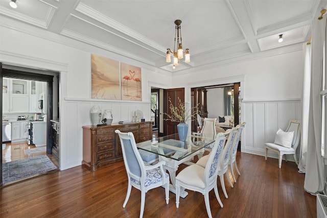 dining room with beamed ceiling, a healthy amount of sunlight, coffered ceiling, and a notable chandelier