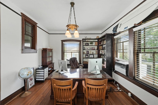 office with dark hardwood / wood-style flooring, cooling unit, a healthy amount of sunlight, and an inviting chandelier