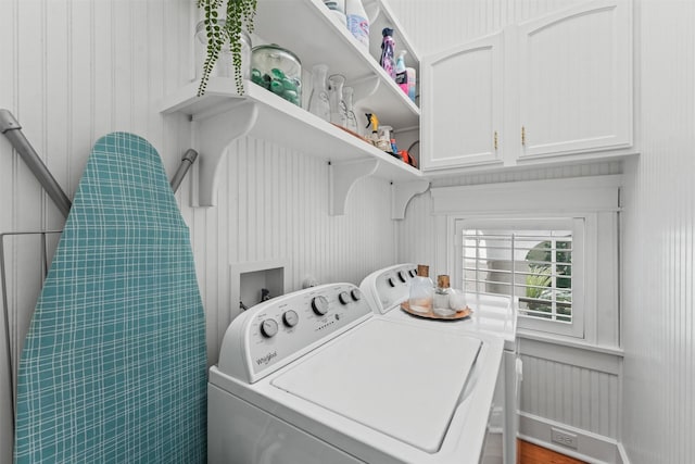 laundry area with cabinets and washer and clothes dryer