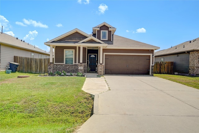 view of front of house featuring a garage and a front lawn