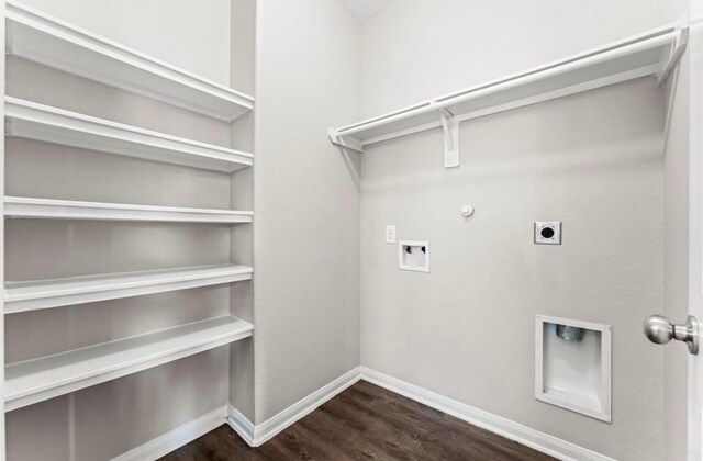 washroom featuring electric dryer hookup, hookup for a gas dryer, washer hookup, and dark hardwood / wood-style floors