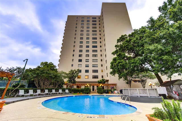 view of swimming pool with a patio area