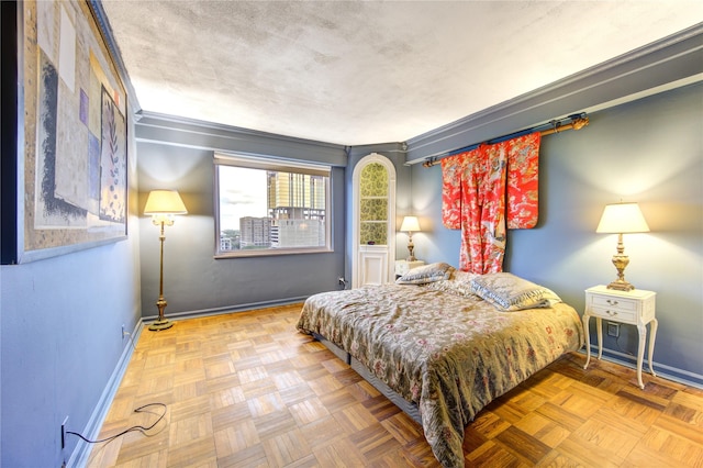 bedroom with parquet flooring