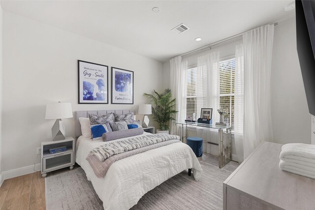 bedroom with light hardwood / wood-style floors