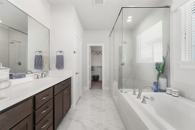 bathroom featuring vanity and plus walk in shower