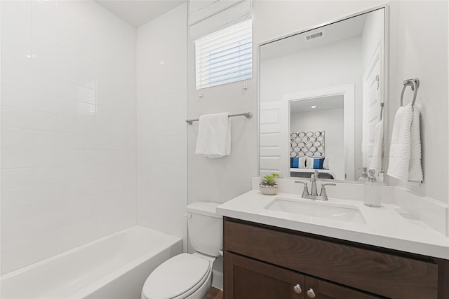 full bathroom featuring vanity, toilet, and shower / washtub combination