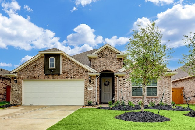 view of front property with a garage and a front lawn