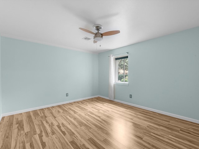 empty room with ceiling fan and light wood-type flooring