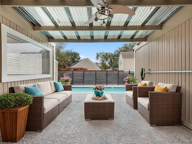 view of patio / terrace featuring an outdoor hangout area, ceiling fan, and a fenced in pool