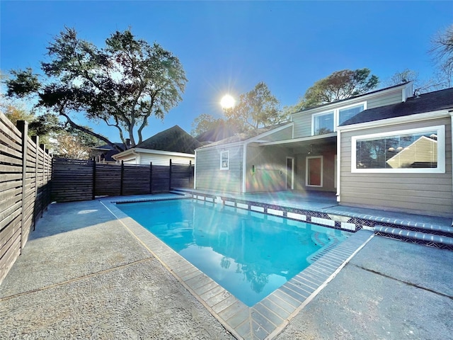 view of swimming pool with a patio