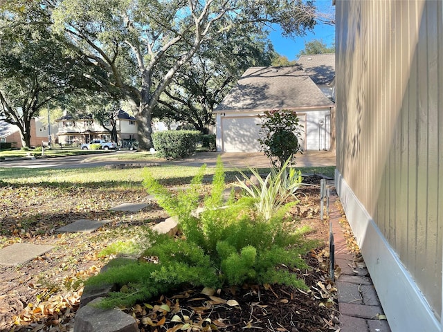 view of yard with a garage