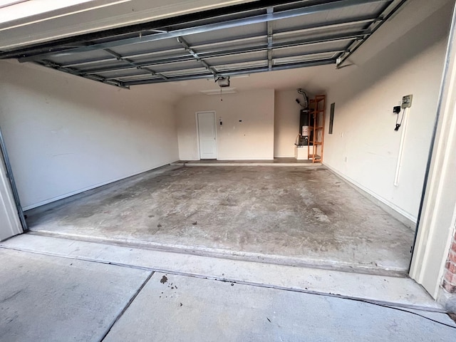 12209 Renewal Way, Houston, TX 77047 - garage with a garage door opener and gas water heater