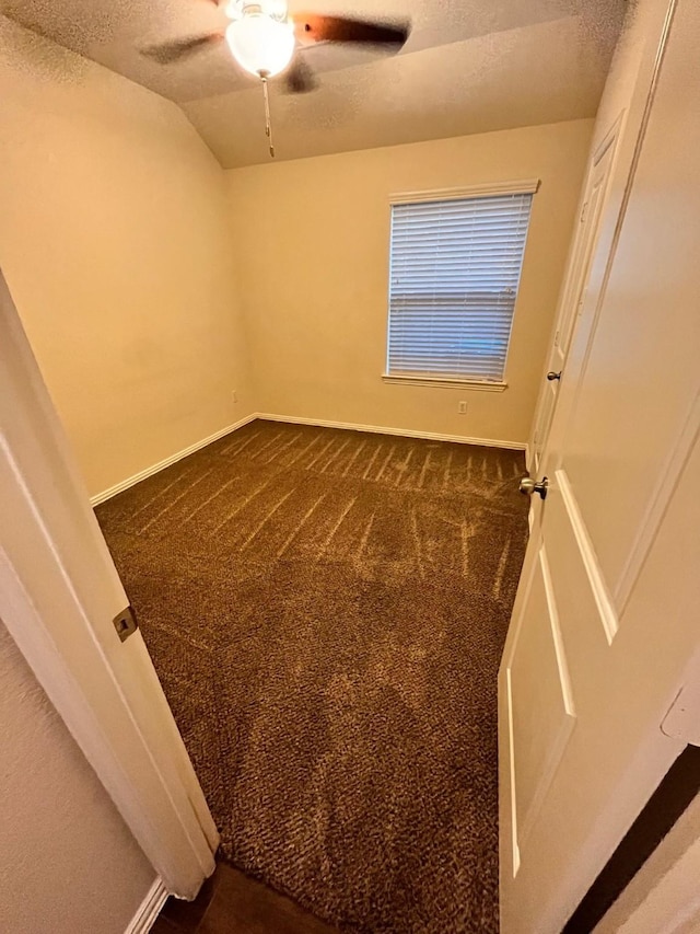 12209 Renewal Way, Houston, TX 77047 - spare room featuring ceiling fan, lofted ceiling, a textured ceiling, and dark carpet