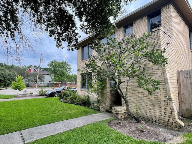 view of side of property with a yard