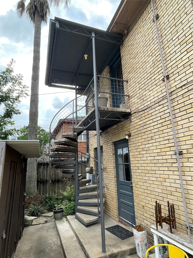 view of side of property featuring a balcony