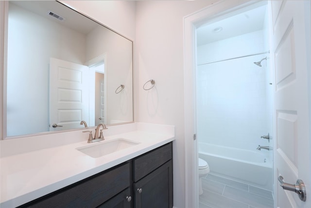 full bathroom featuring tile patterned flooring, vanity, toilet, and shower / washtub combination