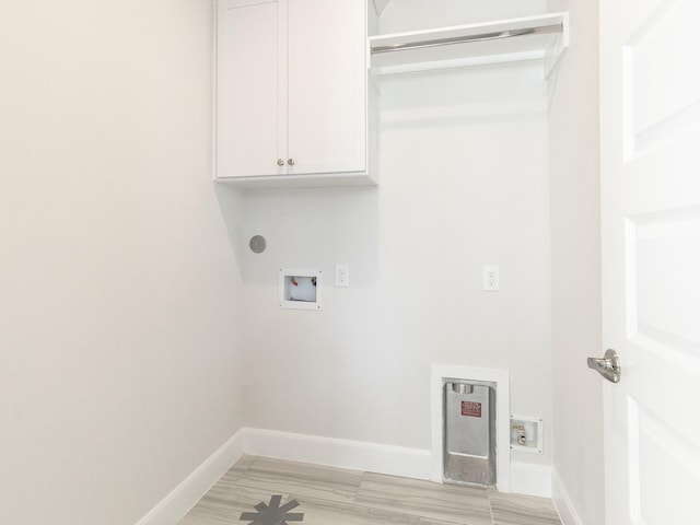 washroom featuring cabinets and hookup for a washing machine