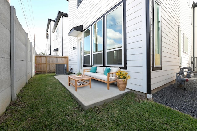 back of property with a patio area, outdoor lounge area, a yard, and central AC unit