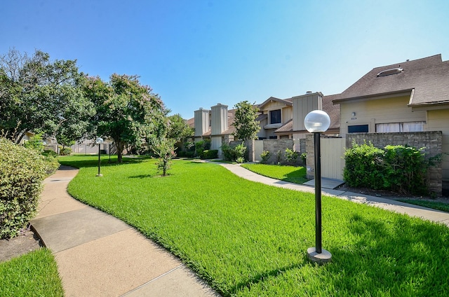 surrounding community featuring a yard