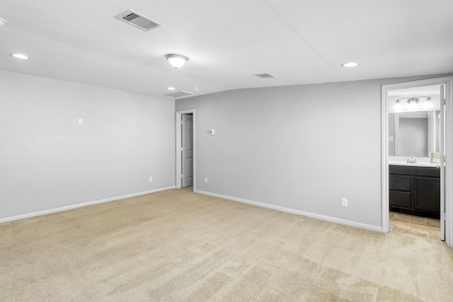 carpeted empty room with sink