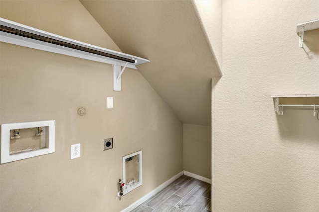 clothes washing area with hookup for an electric dryer, hookup for a gas dryer, and hookup for a washing machine