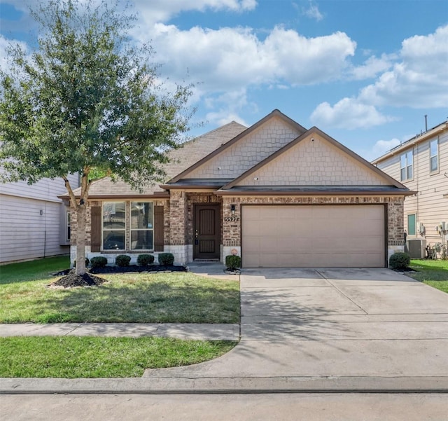 craftsman inspired home with driveway, an attached garage, a front lawn, and brick siding