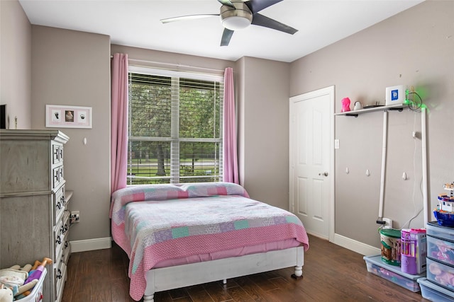 bedroom featuring ceiling fan and dark wood-type flooring