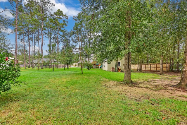 view of yard with a storage unit