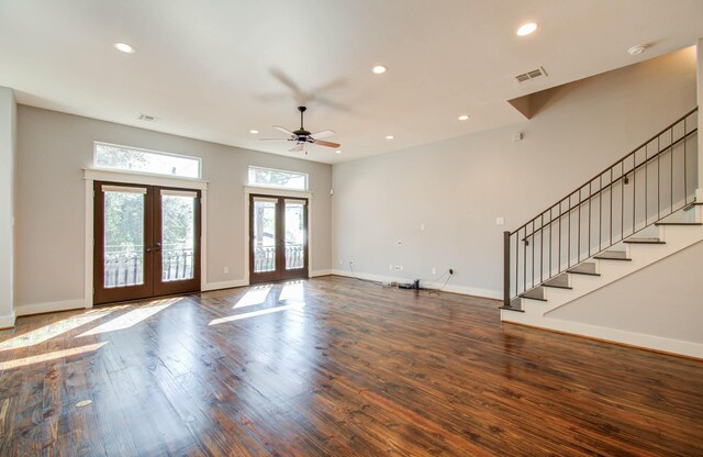 unfurnished living room with ceiling fan, dark wood-type flooring, and french doors