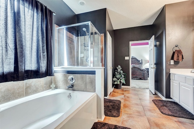 bathroom featuring tile patterned flooring, vanity, and independent shower and bath