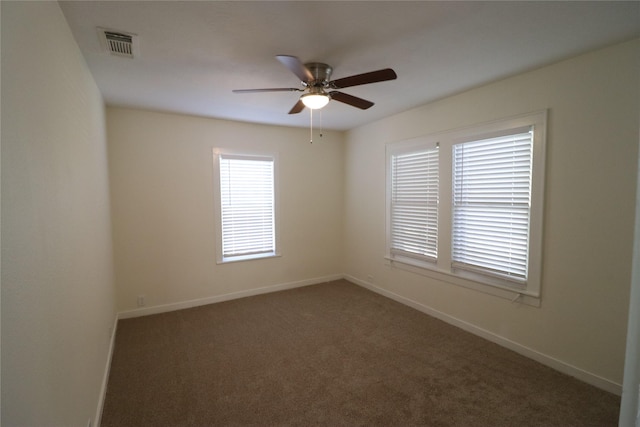 carpeted empty room featuring ceiling fan