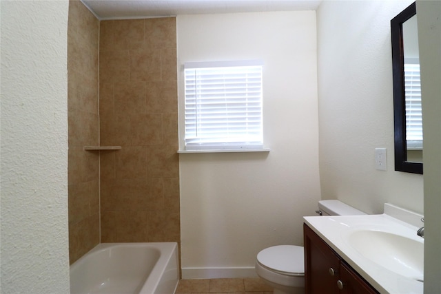 full bathroom featuring tiled shower / bath, tile patterned flooring, vanity, and toilet