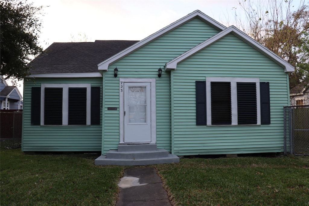 bungalow with a front lawn