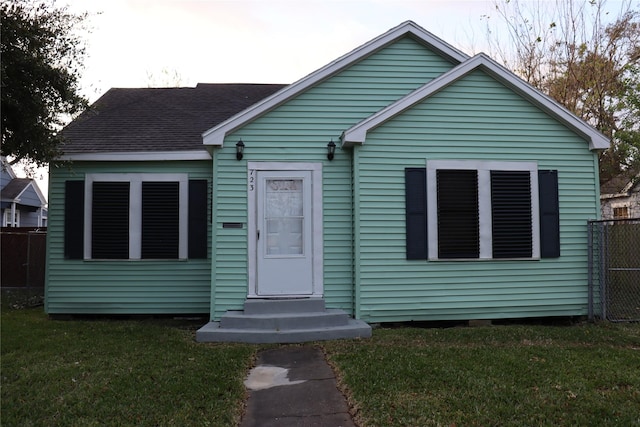 bungalow with a front lawn