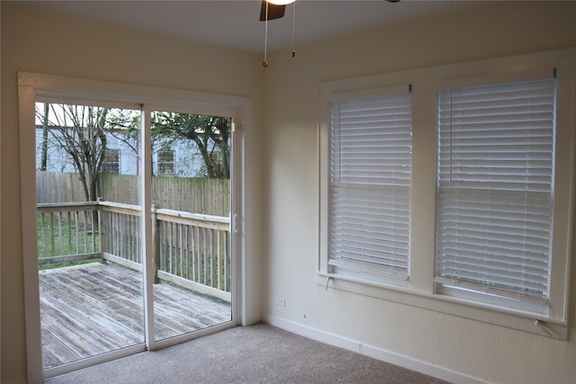 interior space featuring carpet flooring and ceiling fan