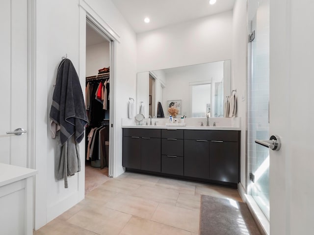 bathroom featuring vanity and an enclosed shower