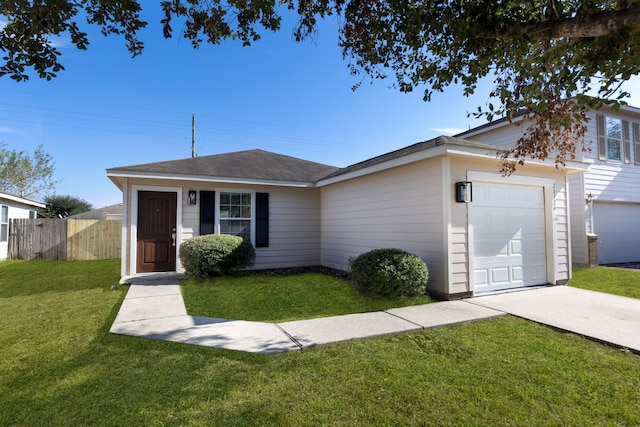 ranch-style house with a garage and a front lawn