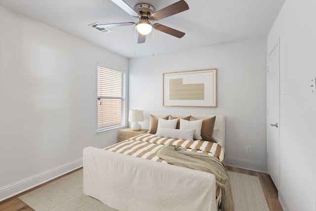 bedroom with hardwood / wood-style flooring and ceiling fan