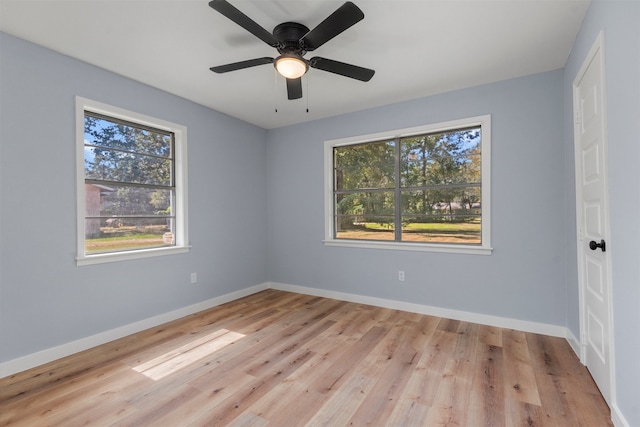 spare room featuring ceiling fan and light hardwood / wood-style flooring