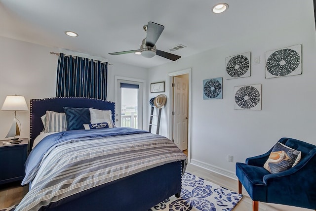 bedroom featuring light hardwood / wood-style flooring and ceiling fan