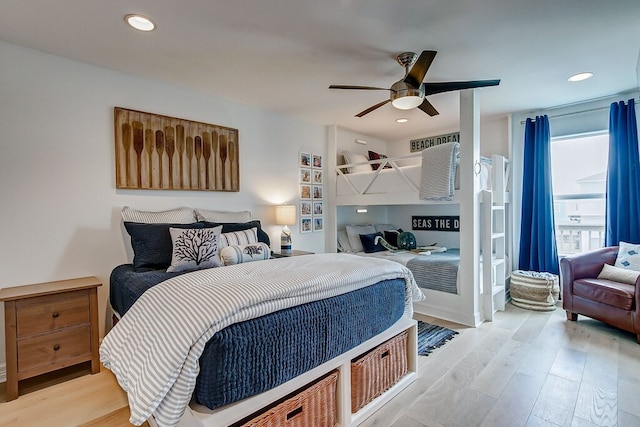 bedroom featuring ceiling fan and light hardwood / wood-style flooring