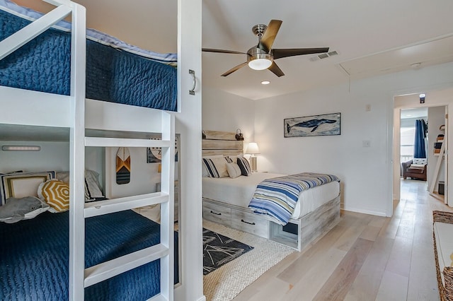 bedroom featuring hardwood / wood-style floors and ceiling fan