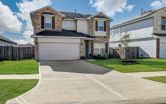 view of front facade with a front yard and a garage