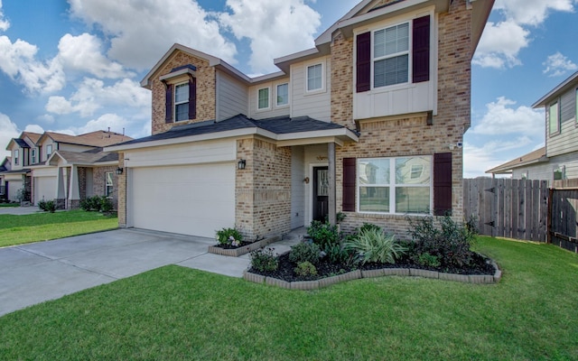 view of front facade with a front yard and a garage